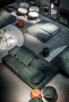 an image of a living room with couches and tables on the bottom right hand corner