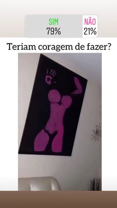 a pink and black painting hanging on the wall