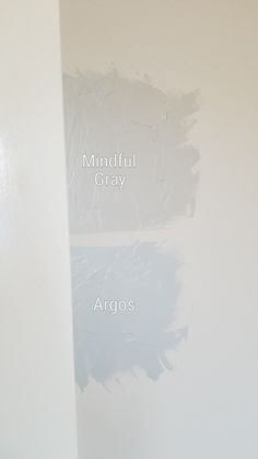 the wall is white and has three different shades of paint on it, including gray