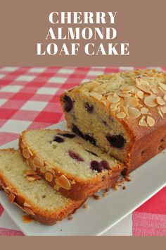 a loaf of cherry almond loaf cake on a plate