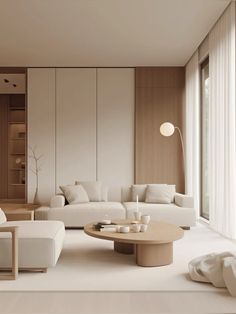 a living room filled with white furniture and lots of windows