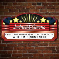 a sign on the side of a brick wall that says jackson's cinema enjoy the first movie release with william e smith