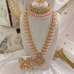 Luxurious Antique Gold Bridal set in choker style, with long mala, long jhumka earrings and tikka. Made up of of golden crystals, thousands of tiny pearls and pink glass beads. This set is ready to ship as seen with gift box. Desi Necklace, Long Jhumka Earrings, Green Clutches, Bridal Choker, Kundan Set, Bridal Necklace Set, Choli Designs, Stacked Bangles, Choker Style