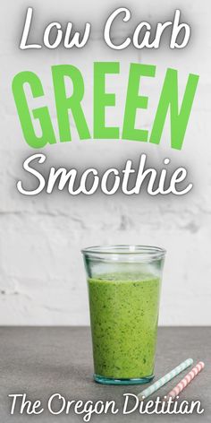 the green smoothie is in a glass with two straws next to it and text low carb green smoothie