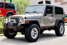 a jeep is parked in front of a building