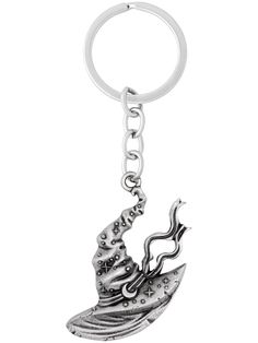 a metal keychain with a witch hat on it's head and a long tail