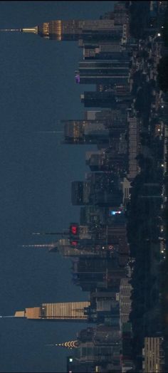 an airplane is flying over the city at night