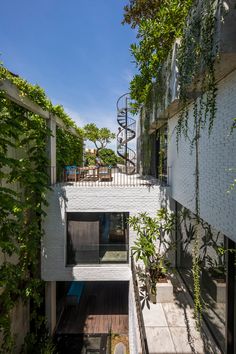 an apartment building with stairs leading up to the second floor