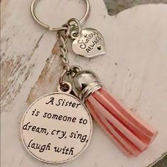 a sister is someone to dream, cry, laugh, laugh with keychain