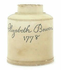 a white vase with writing on it and an inscription in the bottom that says elizabeth bower