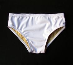 Close-fitting swim brief for MEN is completely lined, has elasticized waist and legs. Elastic waist provides a secure fit without a drawstring. Sides are about 3 inches in depth. See the Policies section of my shop for payment options, return policy, and shipping information. White Stretch Bottoms For Pool, Fitted White Surfing Bottoms, White Stretch Swimming Bottoms, White Brief Swim Trunks For Beach, Sporty Stretch Swim Trunks For Water Polo, Stretch Swimwear With Elastic Waistband For Surfing, Fitted Water Polo Swim Trunks Brief, Fitted Swim Trunks For Water Polo, Fitted Brief Swim Trunks For Water Polo