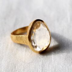 D E T A I L S - Material: 925 Sterling Silver Stone: Crystal The fit: True to US ring size Finish: Smooth and Gold Plated to a high shine S H I P P I N G & P R O D U C T I O N - My current production time is 2-6 business days, which means after those days are up, your order ships! I make everything custom to order, by hand, but I promise you it's worth the wait! R U S H - M Y - O R D E R - If you're in a rush to get your pretty new pieces, please send me a message and I'll let you know just Gold Sterling Silver Moonstone Ring, Timeless Faceted Rings As Gifts, Timeless Faceted Ring As A Gift, Timeless Sparkling Ring As A Gift, Moonstone Ring With Bezel Setting For Anniversary, Bezel-set Moonstone Ring For Anniversary, Bezel Set Moonstone Ring For Anniversary, Clear Quartz Ring, Ring Crystal