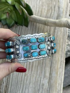 New without tags ETHNIC & REGIONAL STYLE : Native American TYPE : Bracelet SIGNED : Yes COLOR : Blue STYLE : Cuff TRIBAL AFFILIATION : Navajo The Mother of All Cuffs! Check out this incredible Multi Turquoise Custom cuff. This baby is 6 inches inside circumference with a 1 inch gap. Width 1 1/2 inches. Weight 76 grams. Signed by Artist and Stamped Sterling. Thank you for looking at our items. Please contact us if you have any questions. Exported By exportyourstore.com Blue Style, Sterling Silver Cuff, American Jewelry, Tiffany Blue, Native American Jewelry, Silver Cuff, Turquoise Sterling Silver, Blue Fashion, Body Jewelry