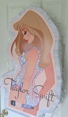 a paper cut out of a woman's body with the words taylor swift on it