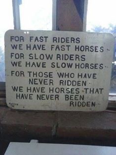 a sign that is on the side of a building saying for fast riders, we have fast horses for slow riders