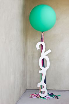 a balloon with the number 26 on it and balloons in front of it that read, diy giant message balloons studio diy