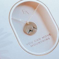 You can move mountains.Product DetailsNecklace comes in either gold-filled or sterling silverChain can be adjusted from 16 to 18 inchesCharm measures 1/2 inches in diameterHand stamped2 inch necklace extenders can be purchased separatelyEver Aster inspires meaningful connections by spreading hope and simplicity through its jewelry. These pieces are the perfect gift to convey a heartfelt message to your loved one that shines with thoughtfulness, kindness, and gratitude. We hope you find as much j Adjustable Meaningful Necklaces For Everyday, Adjustable Stamped Necklace For Everyday Wear, Adjustable Stamped Necklaces For Everyday, Minimalist Stamped Adjustable Charm Necklaces, Minimalist Adjustable Stamped Charm Necklaces, Personalized Sterling Silver Necklace For Everyday, Nickel-free Minimalist Friendship Necklaces, Minimalist Stamped Charm Necklace, Nickel-free Minimalist Necklace For Friendship