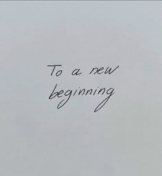 a piece of paper with the words to a new beginning written in black ink on it