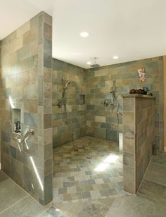 a large bathroom with tiled walls and floor