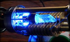 a light that is on top of a metal object with some blue lights in it