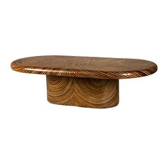 an oval wooden table with wavy lines on it