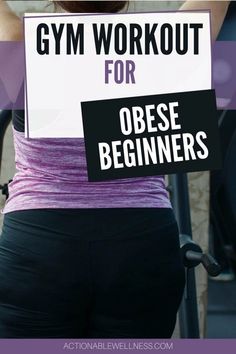 a woman holding a sign that says gym workout for obese beginners