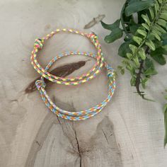 "Colorful boho style bracelet, handmade of Cotton Thread. Perfect for family use. This waterproof bracelet gives you a cool style that expresses your personality.  ♥ ITEM DETAILS: Total length: The size of the bracelet is adjustable. 💕The bracelet has an adjustable closure that will work on a wrist of about 6\" - 7\"💕 Materials: Cotton Thread Cotton Thread Size: Approx. 1.5mm   ♥ GIFT IT Jewelry comes in a cute Canva bag ready to gift! If you wish your item to be a gift, please let me know and Handmade Rainbow Braided Friendship Bracelets, Adjustable Orange Bohemian Friendship Bracelet, Adjustable Yellow Bracelets For Friendship, Adjustable Yellow Bracelet For Friendship, Rainbow Friendship Bracelets With Sliding Knot, Bohemian Rainbow Friendship Bracelets With Sliding Knot, Hippie Style Friendship Bracelets As Gifts, Bohemian Rainbow Friendship Bracelet With Sliding Knot, Yellow Braided Friendship Bracelets