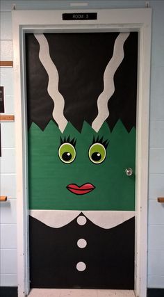 a door decorated with an image of a green monster