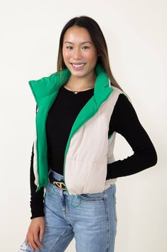 Look your best without sacrificing comfort in this Love Tree Cropped Reversible Puffer Vest for Women in Green/Beige. This reversible vest features a cropped fit for a modern look that's perfect for any occasion. The green and beige colors will make a great addition to your wardrobe. Enjoy the ultimate in fashionable warmth and comfort! Features: Love Tree Style: 5070VY-KELLY Color: Green and Beige 100% Polyester Women’s vest Reversible Center front zipper Puffer design Cropped fit Adjustable wa Trendy Nylon Spring Vest, Trendy Nylon Vest For Spring, Trendy Spring Nylon Vest, Trendy Winter Vest For Everyday Wear, Trendy Green Vest Outerwear, Sporty Spring Outerwear Vest, Sporty Green Vest For Spring, Vest For Women, Reversible Vest