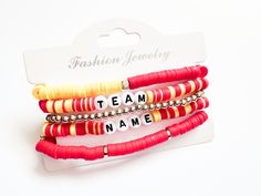 A Chiefs bracelet stack of 5 bracelets. The words Team and Name will be replaced.   Please note the mixed colors like red and yellow will be mixed in at random and may not be placed EXACTLY like this image as well as the gold pieces in the red bracelet.  Please choose bracelet size.  If you are looking for another team message me! Red Stretch Bracelet For Friendship In Trendy Style, Trendy Red Stretch Bracelet For Friendship, Red Trendy Stretch Bracelet With Letter Beads, Trendy Red Stretch Bracelet With Letter Beads, Red Stacked Beaded Bracelets For Gifts, Red Stacked Beaded Bracelets As Gift, Red Adjustable Stacked Bracelets, Adjustable Stacked Red Bracelets, Trendy Red Stackable Beaded Bracelets