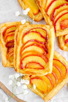 several pieces of fruit tarts on a plate