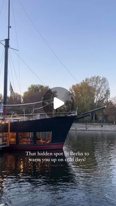 a large boat floating on top of a lake