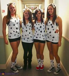 three girls dressed up as dalmatian costumes