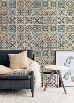 a living room with a couch, table and wallpaper