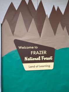 a welcome sign to frazer national forest is posted on the front door of a building