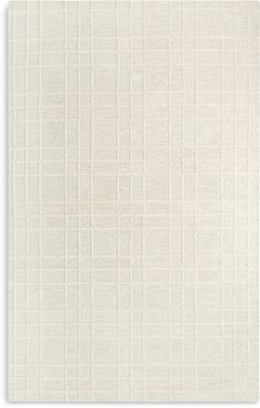 a white rug with squares on it