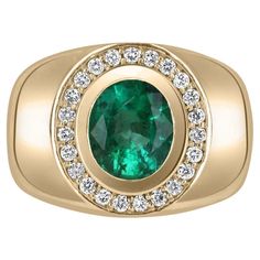 An important Colombian emerald and diamond men's cocktail ring. A large 1.70-carat emerald is bezel set in the very center. The men's ring is made in solid 14K yellow gold and is accented by brilliant round diamonds. This ring has excellent spread and full finger coverage. Smooth and ideal for everyday wear. Setting Style: Cluster Setting Material: 14k Yellow Gold Weight: 8.1 Grams Main Stone: Emerald Shape: Oval Weight:1.70-Carat Clarity: Medium Color: Rich Green Luster: Excellent-Very Good Tre Mens Emerald Rings, Emerald Necklace Pendant, Mens Rings Fashion, Ring Mens, Emerald Pendant, Oval Ring, Rich Green, Men's Jewelry Rings, Gemstone Necklace Pendant