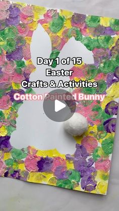 an easter bunny made out of paper and cotton balls on top of a piece of construction paper