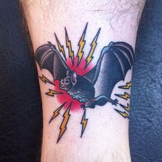 a bat with lightning bolts on its back foot tattoo design for mens leg and wrist