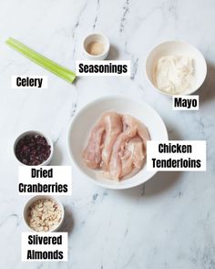 ingredients to make chicken broth in bowls on a white marble countertop with the words, seasonings, mayo, dried cranberries, shredded onions and celery