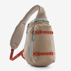 a tan backpack with orange straps on it