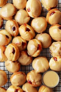 some donuts are sitting on a cooling rack