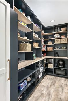 a large walk in pantry with lots of shelves