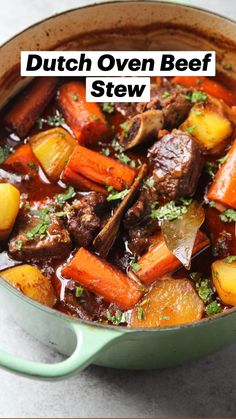 a pot filled with beef stew and carrots