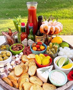 a platter filled with different types of food and condiments on a table