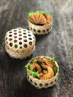 three small baskets filled with food on top of a wooden table