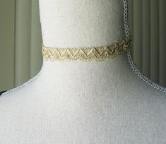 "This gorgeous golden choker is reminiscent of the beautiful 18th and 19th century designs. The choker is 12 1/4\" long with a 2\" extender chain that has a golden glass bead. Has a lobster clasp. It's the perfect fashion accessory, modern or historical. Comes in a lovely gift box with ribbon. Bridgerton inspired. In the Eighteenth and Nineteenth centuries, chokers were very fashionable. Some were made of pearls, lace or ribbon and can be seen in many classic portraits. I think they're a very elegant accessory even today." Silver Choker With Gold Chain For Gift, Adjustable Metal Chain Necklace For Wedding, Gold Adjustable Choker For Formal Occasions, Adjustable Gold Choker For Formal Occasions, Adjustable Vintage Choker Chain Necklace, Elegant Gold Choker With Delicate Chain, Elegant Gold Delicate Chain Choker, Gold Party Choker Chain Necklace, Gold Metal Chain Choker