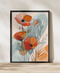 an abstract floral painting with orange and blue flowers on a white wall above a wooden floor