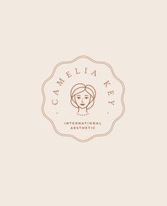 the logo for camellia bay international aesthetictic, which has been designed to look like a woman's face