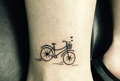 a small bicycle tattoo on the ankle